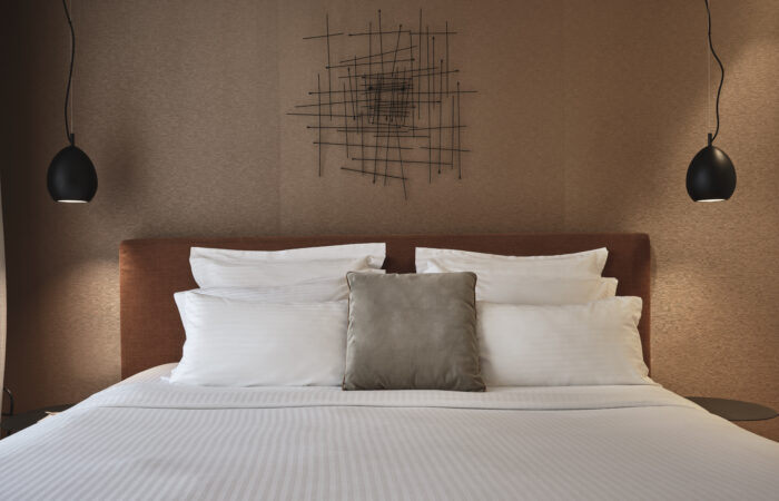 alt="Master Suit's double bed at Sea View Cityscape Hotel"